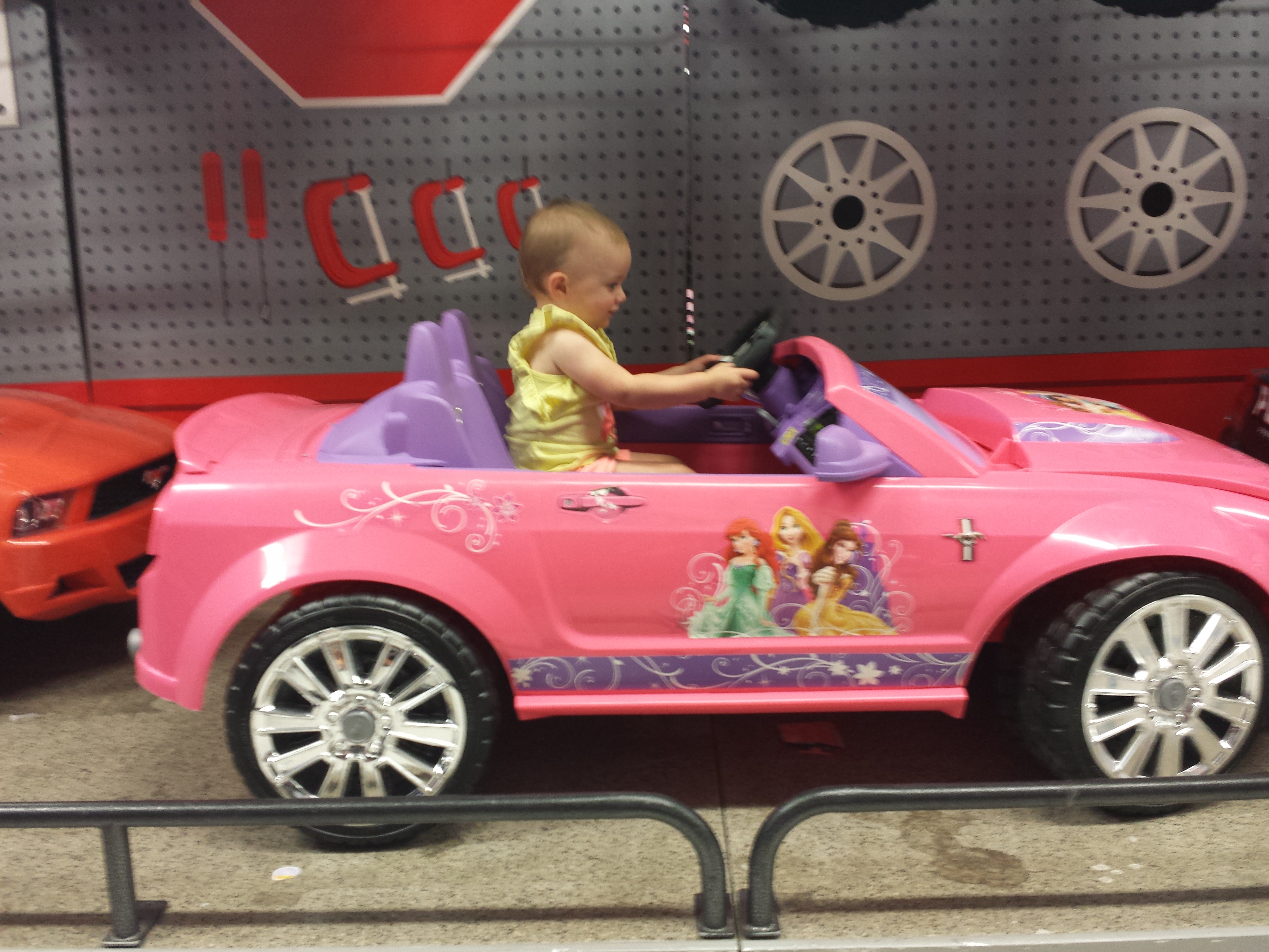 Arianna in pink sports car