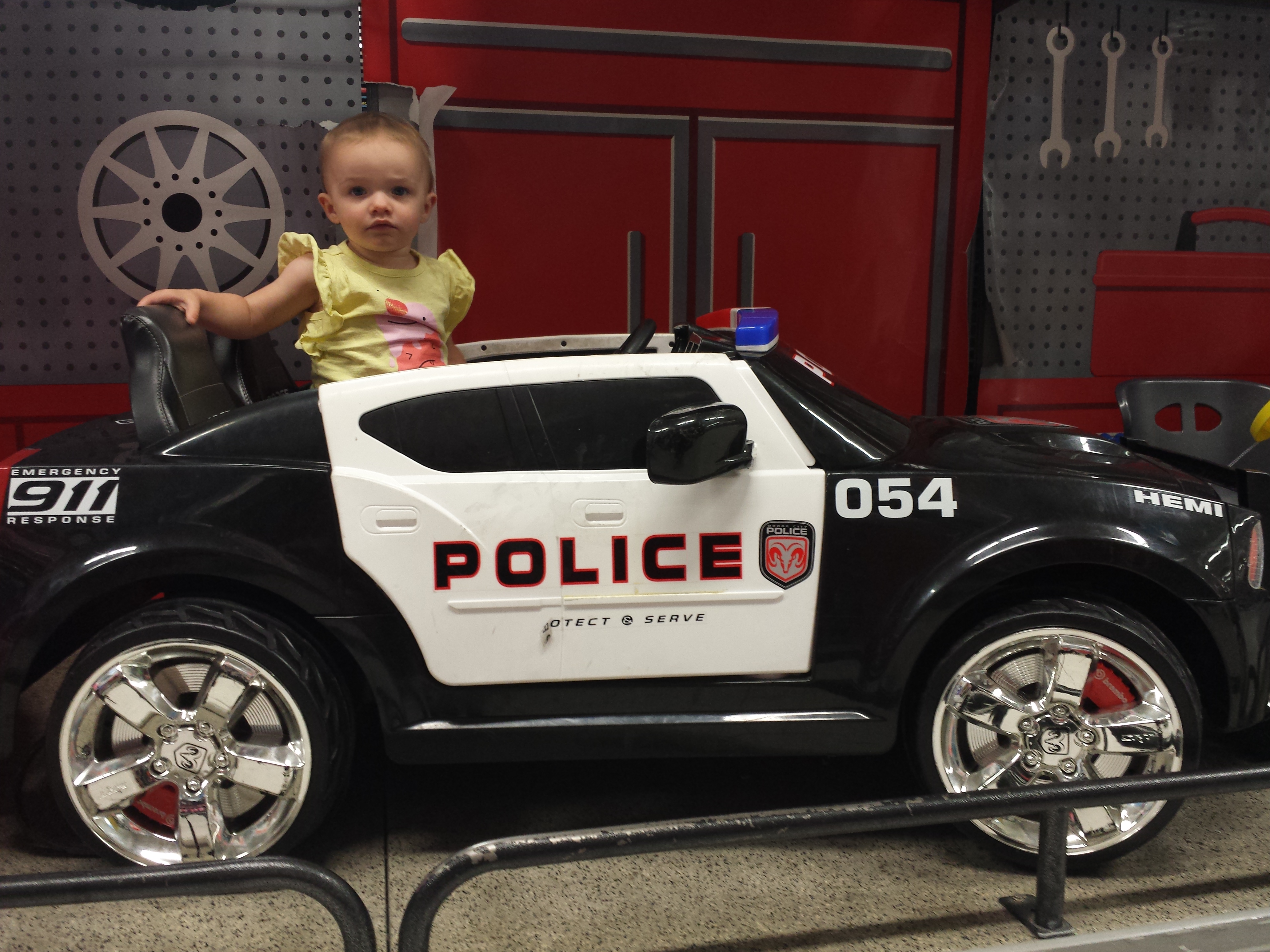 Arianna in police car