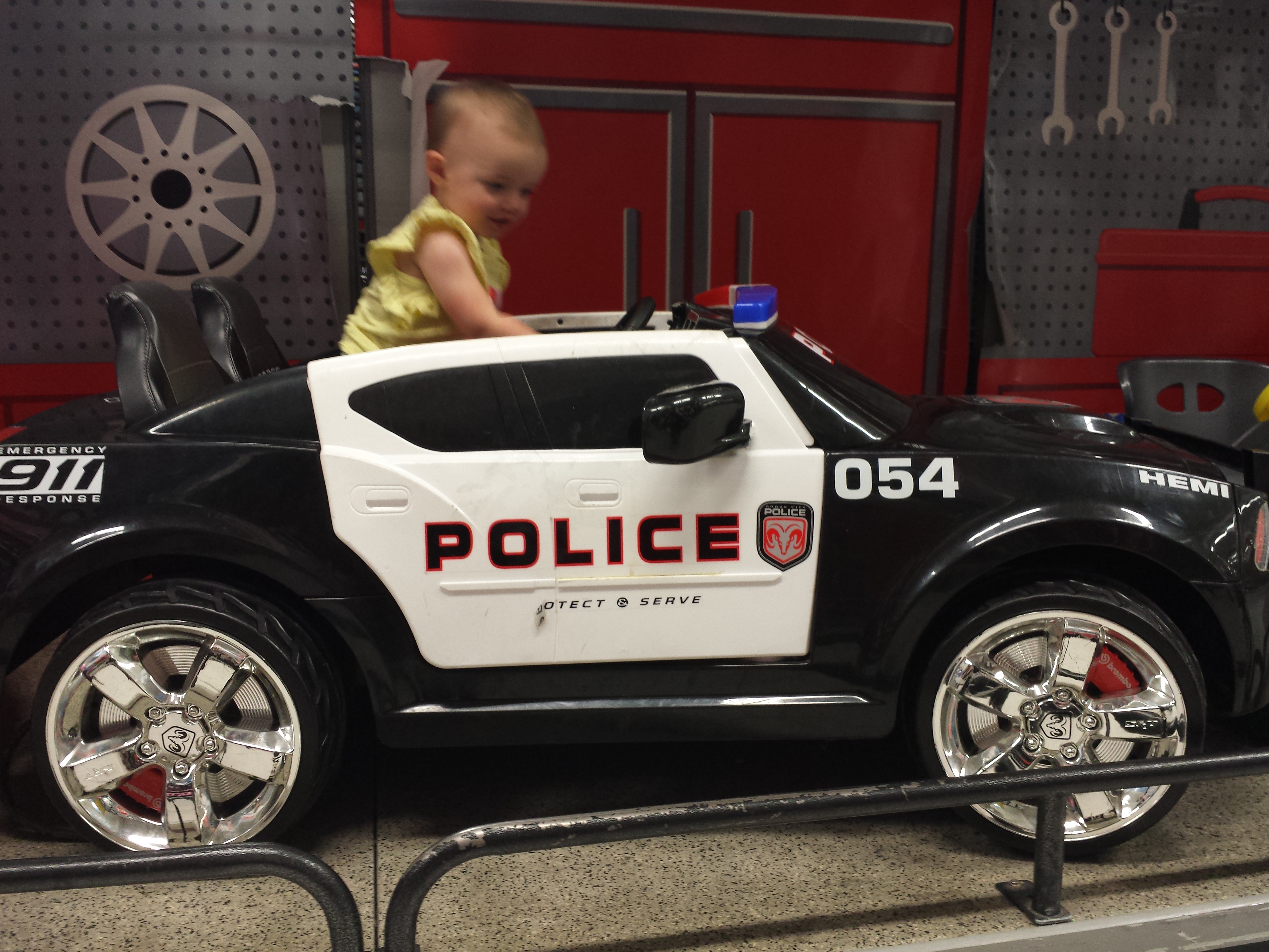 Arianna in police car