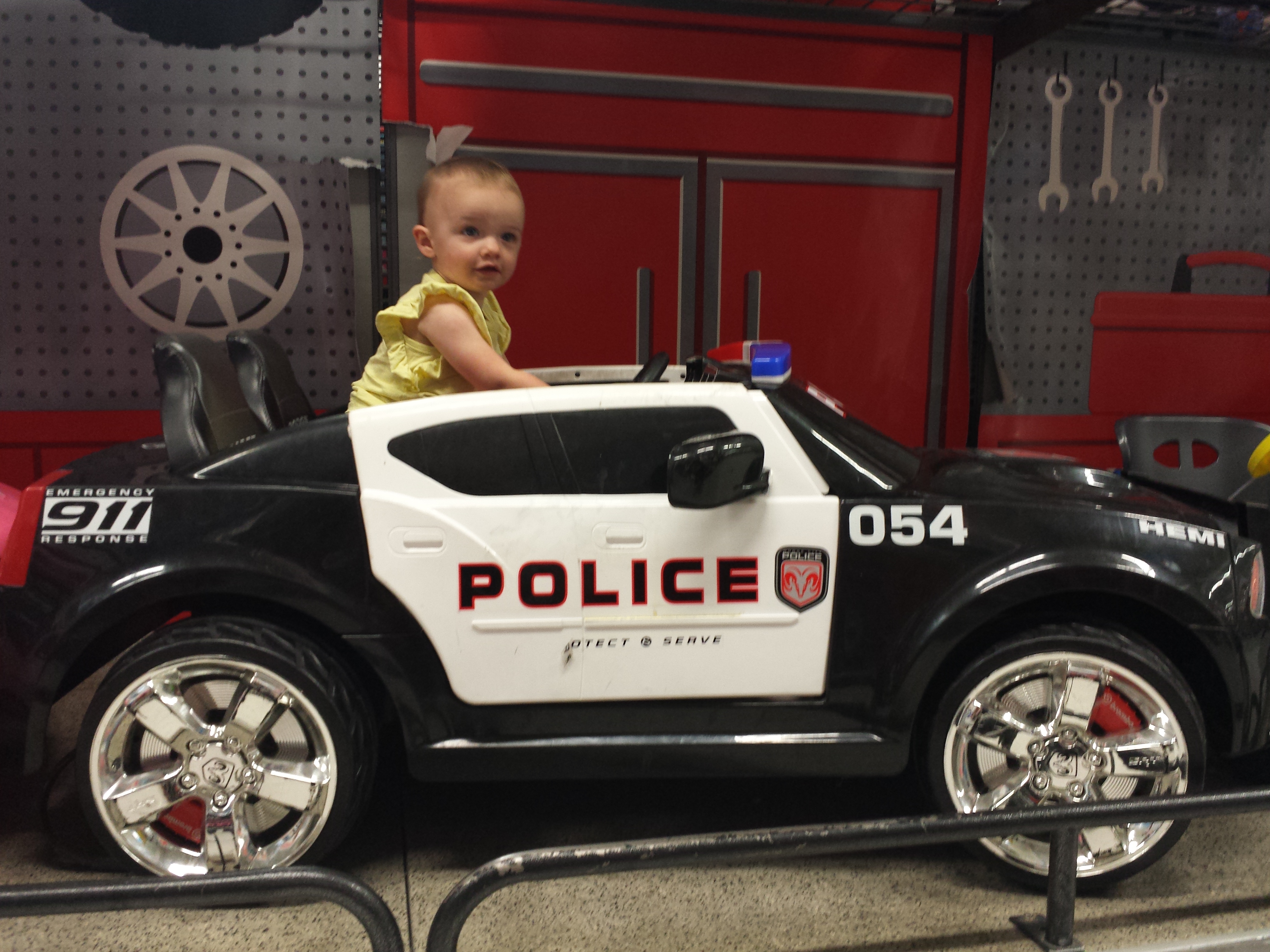 Arianna in police car